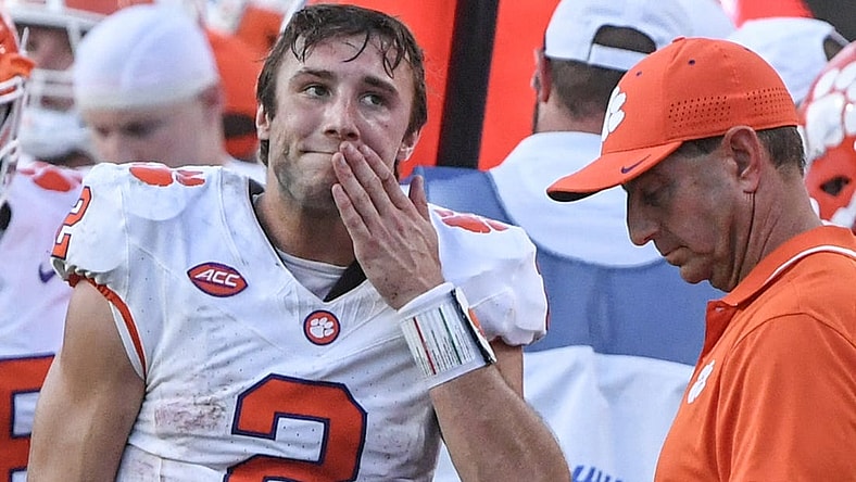 Oct 28, 2023; Raleigh, North Carolina, USA; Clemson Tigers quarterback Cade Klubnik (2) and head coach Dabo Swinney react after a game against the North Carolina State Wolfpack at Carter-Finley Stadium. North Carolina State won 24-17. Mandatory Credit: Ken Ruinard-USA TODAY Sports