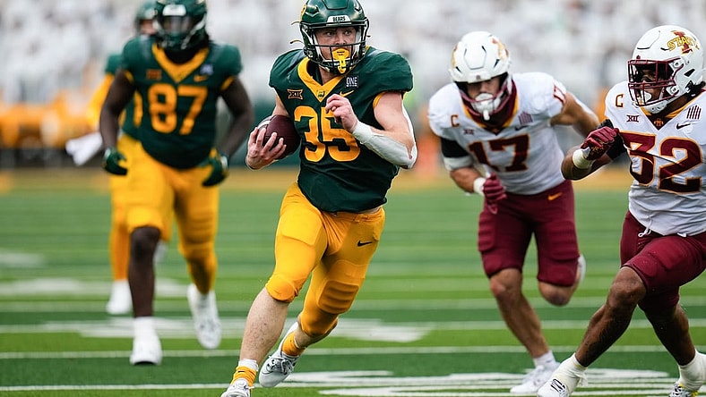 Oct 28, 2023; Waco, Texas, USA;  Baylor Bears running back Dawson Pendergrass (35) runs the ball as Iowa State Cyclones linebacker Gerry Vaughn (32) pursues during the second half at McLane Stadium. Mandatory Credit: Chris Jones-USA TODAY Sports