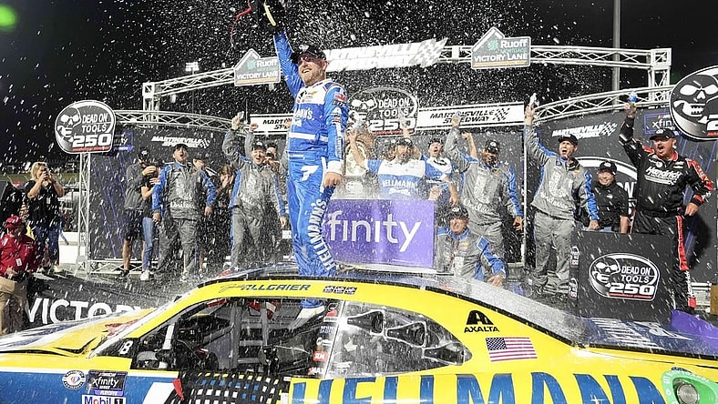 Oct 28, 2023; Martinsville, Virginia, USA; NASCAR Xfinity Series driver Justin Allgaier (7) celebrates after winning the Dead On Tools 250 at Martinsville Speedway. Mandatory Credit: David Yeazell-USA TODAY Sports
