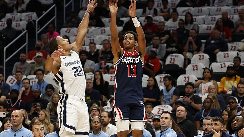 Oct 28, 2023; Washington, District of Columbia, USA; Washington Wizards guard Jordan Poole (13) shoots the ball over Memphis Grizzlies guard Desmond Bane (22) in the first quarter at Capital One Arena. Mandatory Credit: Geoff Burke-USA TODAY Sports