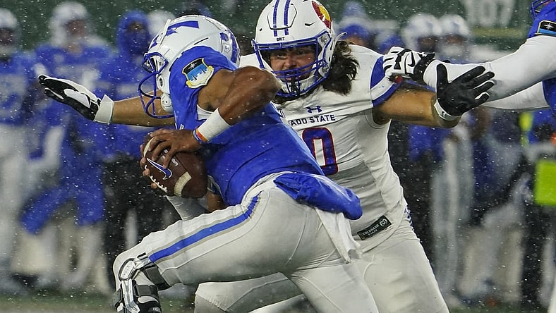 Oct 28, 2023; Fort Collins, Colorado, USA;  Colorado State Rams defensive lineman Grady Kelly (90) chases Air Force Falcons quarterback Zac Larrier (9) in the second quarter at Sonny Lubick Field at Canvas Stadium. Mandatory Credit: Michael Madrid-USA TODAY Sports