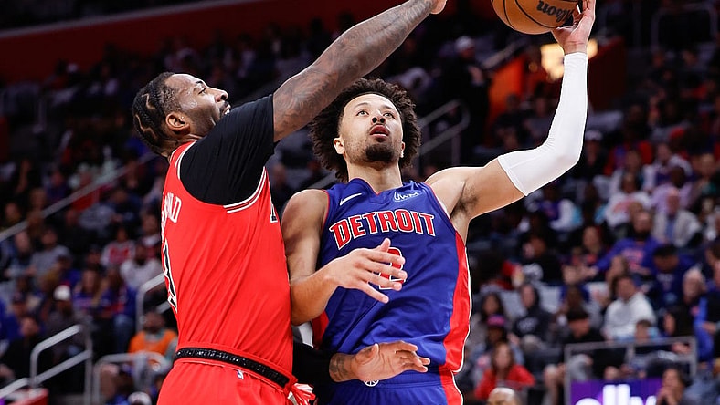Oct 28, 2023; Detroit, Michigan, USA;  Detroit Pistons guard Cade Cunningham (2) shoots on Chicago Bulls center Andre Drummond (3) in the first half at Little Caesars Arena. Mandatory Credit: Rick Osentoski-USA TODAY Sports