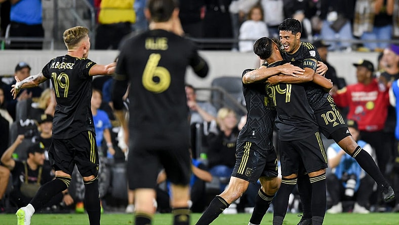 Oct 28, 2023; Los Angeles, CA, USA; Los Angeles FC forward Denis Bouanga (99) celebrates with teammates after scoring a goal against the Vancouver Whitecaps FC in the first half of game one in a round one match of the 2023 MLS Cup Playoffs at BMO Stadium. Mandatory Credit: Jonathan Hui-USA TODAY Sports