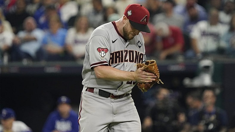 Oct 28, 2023; Arlington, TX, USA; Arizona Diamondbacks relief pitcher Merrill Kelly (29) reacts in the in the seventh inning against the Texas Rangers in game two of the 2023 World Series at Globe Life Field. Mandatory Credit: Raymond Carlin III-USA TODAY Sports