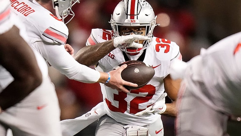 Oct 28, 2023; Madison, Wisconsin, USA; Ohio State Buckeyes quarterback Kyle McCord (6) hands off to running back TreVeyon Henderson (32) during the second half of the NCAA football game against the Wisconsin Badgers at Camp Randall Stadium. Ohio State won 24-10.
