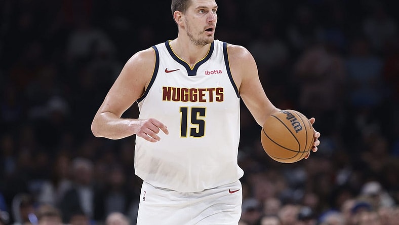 Oct 29, 2023; Oklahoma City, Oklahoma, USA; Denver Nuggets center Nikola Jokic (15) dribbles the ball down the court against the Oklahoma City Thunder during the second quarter at Paycom Center. Mandatory Credit: Alonzo Adams-USA TODAY Sports