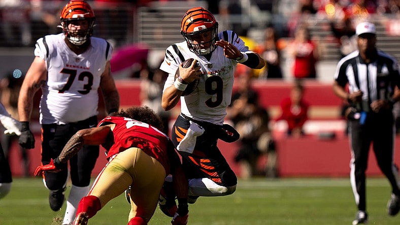 San Francisco 49ers safety Talanoa Hufanga (29) tackles Cincinnati Bengals quarterback Joe Burrow (9) in the second quarter of the NFL game between the Cincinnati Bengals and the San Francisco 49ers at Levi Stadium in Santa Clara, Calif., on Sunday, Oct 29, 2023.