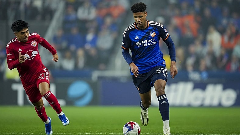 Oct 29, 2023; Cincinnati, OH, USA; FC Cincinnati defender Ian Murphy (32) dribbles the ball against the New York Red Bulls during the first half of game one in a round one match of the 2023 MLS Cup Playoffs at TQL Stadium. Mandatory Credit: Aaron Doster-USA TODAY Sports