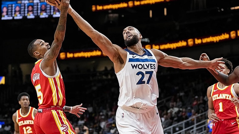 Oct 30, 2023; Atlanta, Georgia, USA; Minnesota Timberwolves center Rudy Gobert (27) and Atlanta Hawks guard Dejounte Murray (5) fight for a rebound during the first half at State Farm Arena. Mandatory Credit: Dale Zanine-USA TODAY Sports