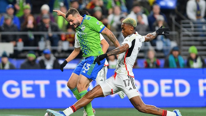 Oct 30, 2023; Seattle, Washington, USA; Seattle Sounders FC forward Jordan Morris (13) is challenged by FC Dallas defender Nkosi Tafari (17) during the second half of game one in a round one match of the 2023 MLS Cup Playoffs at Lumen Field. Mandatory Credit: Steven Bisig-USA TODAY Sports