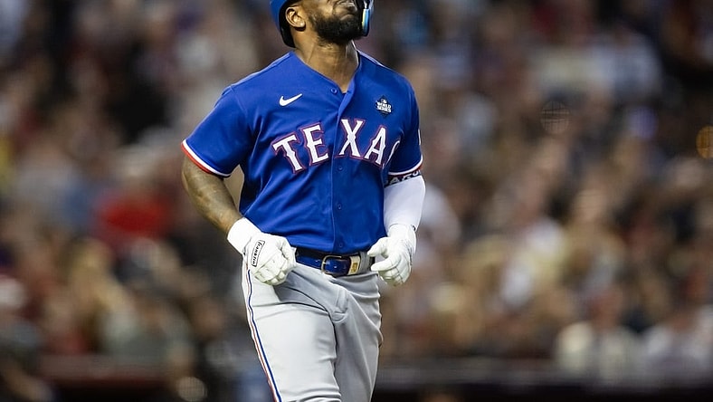 Oct 30, 2023; Phoenix, AZ, USA; Texas Rangers right fielder Adolis Garcia (53) reacts after after suffering an injury in the eighth inning of game three of the 2023 World Series against the Arizona Diamondbacks at Chase Field. Mandatory Credit: Mark J. Rebilas-USA TODAY Sports
