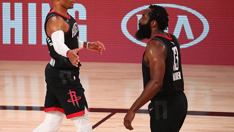 Sep 8, 2020; Lake Buena Vista, Florida, USA; Houston Rockets guard Russell Westbrook (left) celebrates with guard James Harden (13) after dunking against the Los Angeles Lakers during the first half of game three in the second round of the 2020 NBA Playoffs at AdventHealth Arena. Mandatory Credit: Kim Klement-USA TODAY Sports