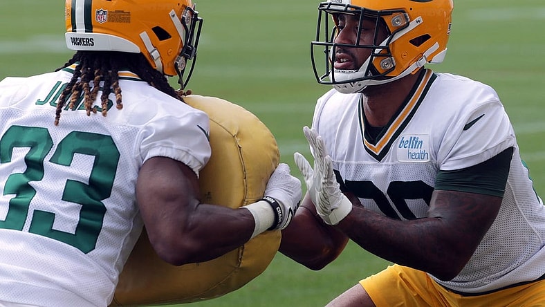July 29, 2021; Green Bay, WI, USA; Green Bay Packers running back Aaron Jones (33) and running back A.J. Dillon (28) take part in a drill during the second day of training camp Thursday, July 29, 2021 in Green Bay, Wis.Mandatory Credit: Mark Hoffman-USA TODAY NETWORK