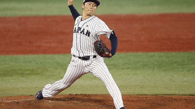 Aug 4, 2021; Yokohama, Japan; Team Japan pitcher Yoshinobu Yamamoto (17) throws a pitch against Korea in a baseball semifinal match during the Tokyo 2020 Olympic Summer Games at Yokohama Baseball Stadium. Mandatory Credit: Yukihito Taguchi-USA TODAY Sports