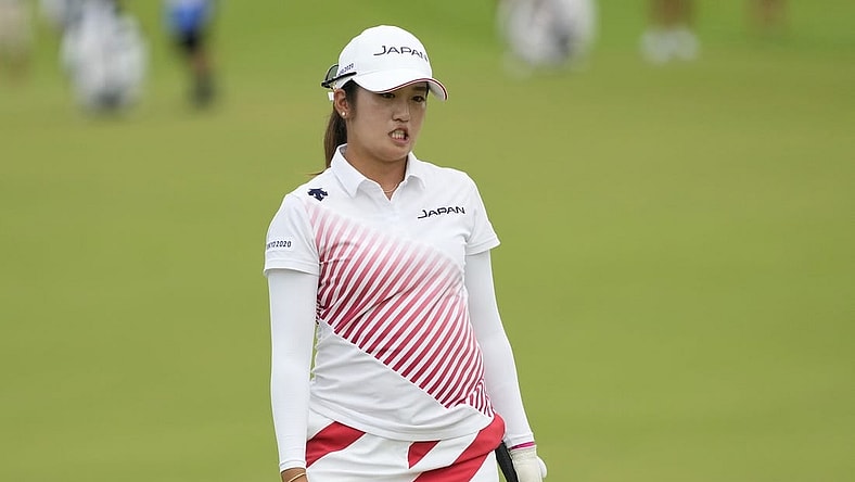 Aug 7, 2021; Tokyo, Japan; Mone Inami (JPN) reacts after her putt on the 18th hole during the final round of the women's individual stroke play of the Tokyo 2020 Olympic Summer Games at Kasumigaseki Country Club. Mandatory Credit: Michael Madrid-USA TODAY Sports