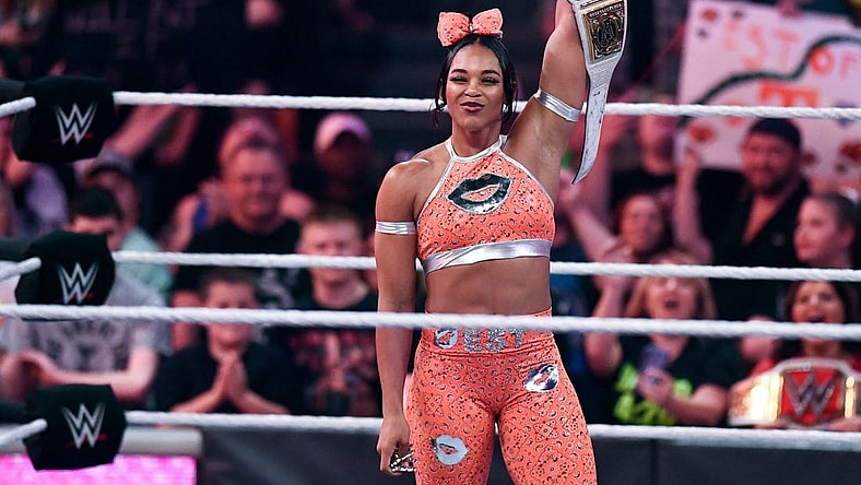 This year's Big 12 conference championship Most Outstanding Player receives a custom-made belt, such as the version WWE women's champion Bianca Belair raises in the file photo from an event in Knoxville, Tenn., in 2022. 

Kns Biancahomecoming 0427