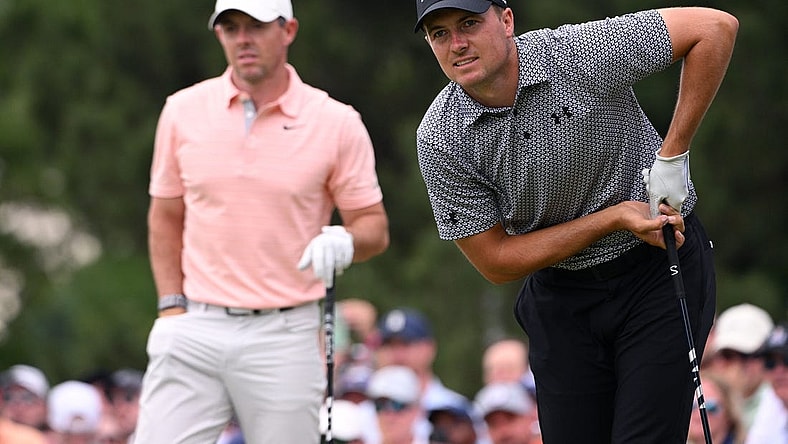 May 20, 2022; Tulsa, Oklahoma, USA; Jordan Spieth (right) watches his shot on the seventh tee alongside Rory McIlroy during the second round of the PGA Championship golf tournament at Southern Hills Country Club. Mandatory Credit: Orlando Ramirez-USA TODAY Sports