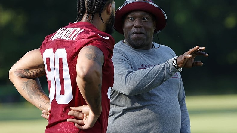 Jun 15, 2022; Ashburn, Virginia, USA; Washington Commanders defensive end Montez Sweat (90) talks with special consultant and NFL Hall of Fame member Warren Sapp (R) on day two of minicamp at The Park. Mandatory Credit: Geoff Burke-USA TODAY Sports