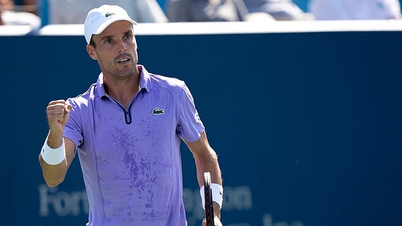 Roberto Bautista Agut reacts to winning a point against Borna Coric during the second set of their match in the Western & Southern Open at the Lindner Family Tennis Center in Mason, Ohio, on Thursday, Aug. 18, 2022.

Western Southern Open Day Four Night 828