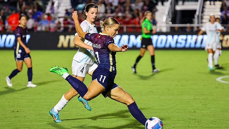 Sep 24, 2022; Cary, North Carolina, USA; North Carolina Courage defender Merritt Mathias (11) controls the ball as New Jersey/New York Gotham FC forward Paige Monaghan (4) defends during the second half at WakeMed Soccer Park. Mandatory Credit: Jaylynn Nash-USA TODAY Sports