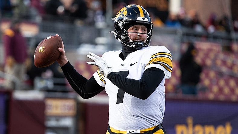 Nov 19, 2022; Minneapolis, Minnesota, USA; Iowa Hawkeyes quarterback Spencer Petras (7) warms up before the game against the Minnesota Golden Gophers at Huntington Bank Stadium. Mandatory Credit: Matt Krohn-USA TODAY Sports