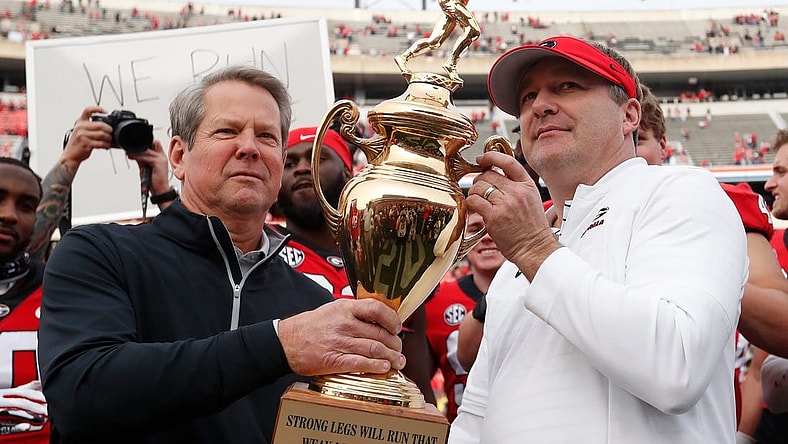 Georgia Gov. Brian Kemp presents Georgia coach Kirby Smart with the Governors Cup after a NCAA college football game between Georgia Tech and Georgia in Athens, Ga., on Saturday, Nov. 26, 2022. Georgia won 37-14.

News Joshua L Jones
