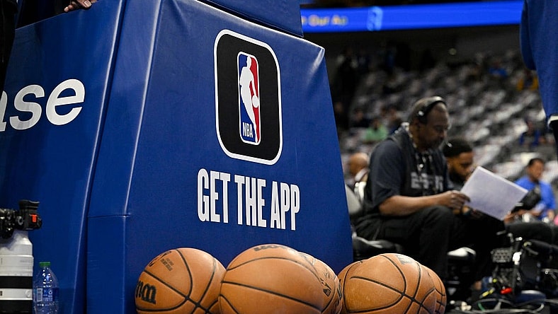Mar 5, 2023; Dallas, Texas, USA; A view of the NBA logo and NBA app logo and basketballs in front of the base during warms up before the game between the Dallas Mavericks and the Suns at the American Airlines Center. Mandatory Credit: Jerome Miron-USA TODAY Sports