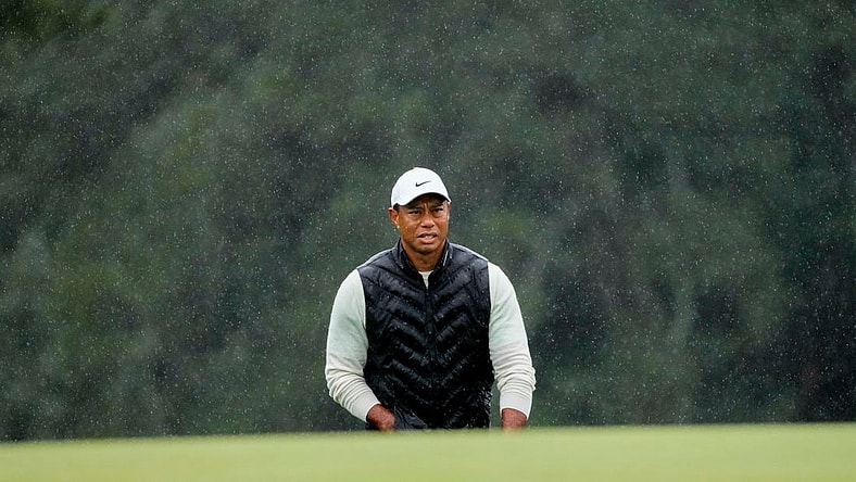 Tiger Woods lines up his putt on the 18th green during the second round of the Masters.

Pga Masters Tournament Completion Of Second Round