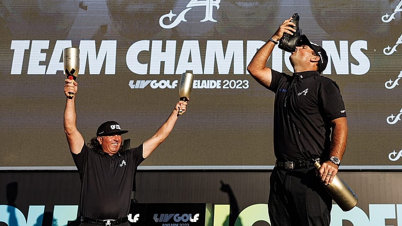 Apr 23, 2023; Adelaide, South Australia, AUS; Team Aces (Pat Perez, Dustin Johnson, Peter Uihlein) celebrate their victory in the team competition, following the final round of LIV Golf Adelaide golf tournament at Grange Golf Club. Mandatory Credit: Mike Frey-USA TODAY Sports