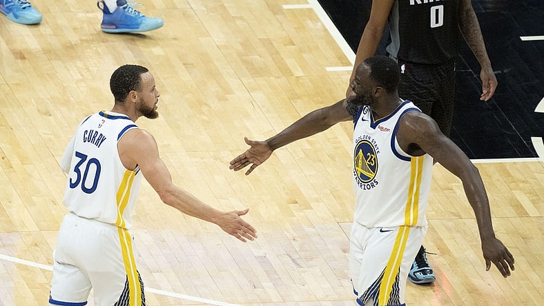 April 30, 2023; Sacramento, California, USA; Golden State Warriors guard Stephen Curry (30) celebrates with forward Draymond Green (23) during the fourth quarter in game seven of the 2023 NBA playoffs first round against the Sacramento Kings at Golden 1 Center. Mandatory Credit: Kyle Terada-USA TODAY Sports