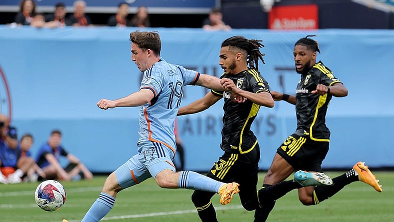 Jun 17, 2023; New York, New York, USA; New York City FC forward Gabriel Segal (19) scores a goal against Columbus Crew SC defenders Mohamed Farsi (23) and Steven Moreira (31) during the second half at Yankee Stadium. Mandatory Credit: Brad Penner-USA TODAY Sports