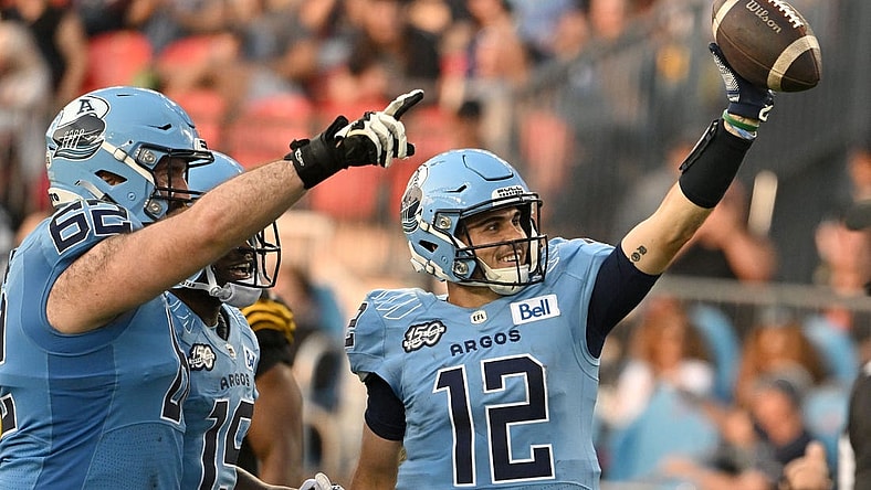 Jun 18, 2023; Toronto, Ontario, CAN;  Toronto Argonauts quarter Chad Kelly (2) celebrates after scoring a touchdown against the Hamilton Tiger-Cats in the second quarter at BMO Field. Mandatory Credit: Dan Hamilton-USA TODAY Sports