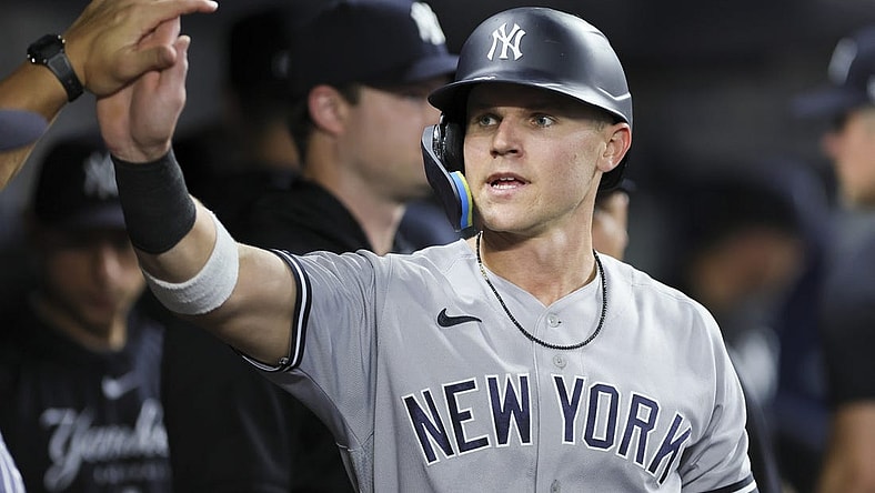 Aug 11, 2023; Miami, Florida, USA; New York Yankees first baseman Jake Bauers (61) celebrates after scoring against the Miami Marlins during the fourth inning at loanDepot Park. Mandatory Credit: Sam Navarro-USA TODAY Sports