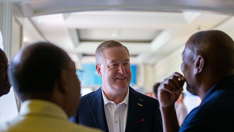 Florida State Athletics Director Michael Alford talks with Tallahassee Chamber of Commerce Conference attendees during a break on Saturday, Aug. 19, 2023.