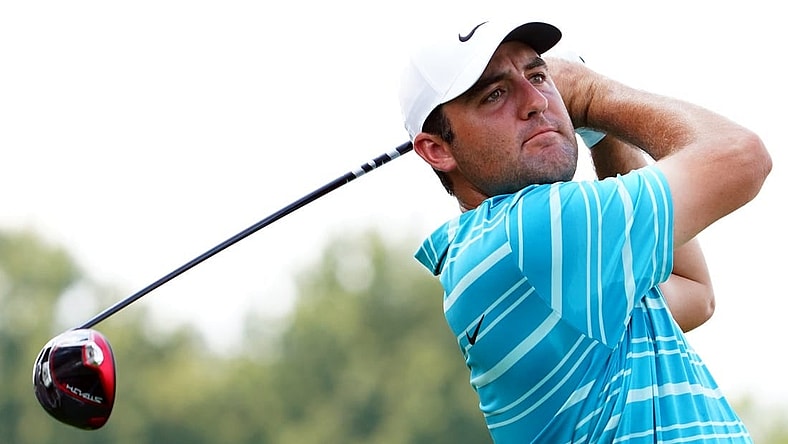 Aug 26, 2023; Atlanta, Georgia, USA; Scottie Scheffler plays his shot from the fourth tee during the third round of the TOUR Championship golf tournament at East Lake Golf Club. Mandatory Credit: John David Mercer-USA TODAY Sports