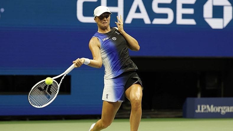 Sep 3, 2023; Flushing, NY, USA; Iga Swiatek of Poland hits a forehand against Jelena Ostapenko of Latvia (not pictured) on day seven of the 2023 U.S. Open tennis tournament at USTA Billie Jean King National Tennis Center. Mandatory Credit: Geoff Burke-USA TODAY Sports