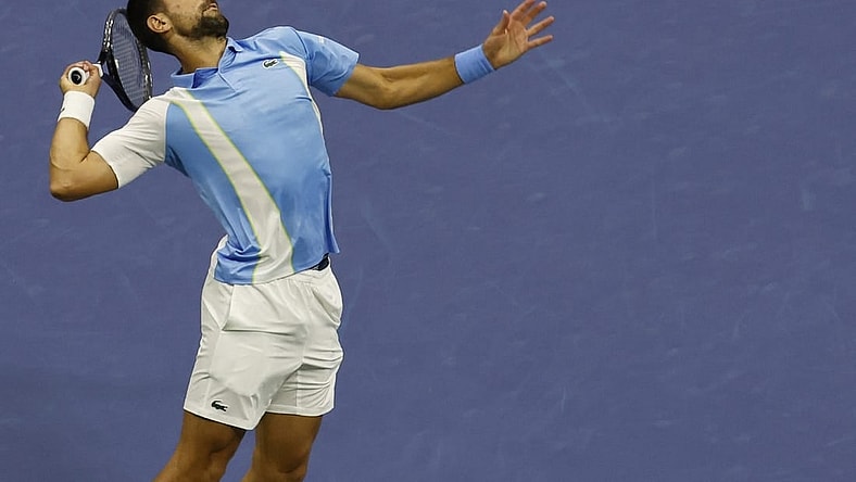 Sep 8, 2023; Flushing, NY, USA; Novak Djokovic of Serbia serves against Ben Shelton of the United States (not pictured) in a men's singles semifinal on day twelve of the 2023 U.S. Open tennis tournament at USTA Billie Jean King Tennis Center. Mandatory Credit: Geoff Burke-USA TODAY Sports