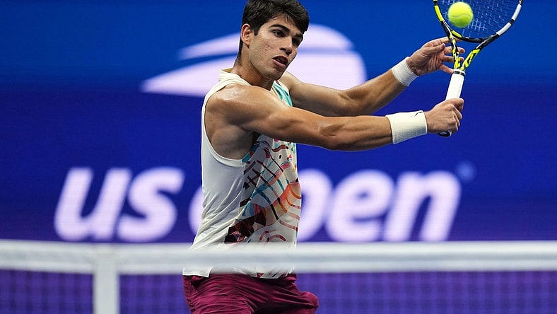 Sep 8, 2023; Flushing, NY, USA; Carlos Alcaraz of Spain hits to Daniil Medvedev in a men's singles semifinal on day twelve of the 2023 U.S. Open tennis tournament at USTA Billie Jean King Tennis Center. Mandatory Credit: Danielle Parhizkaran-USA TODAY Sports