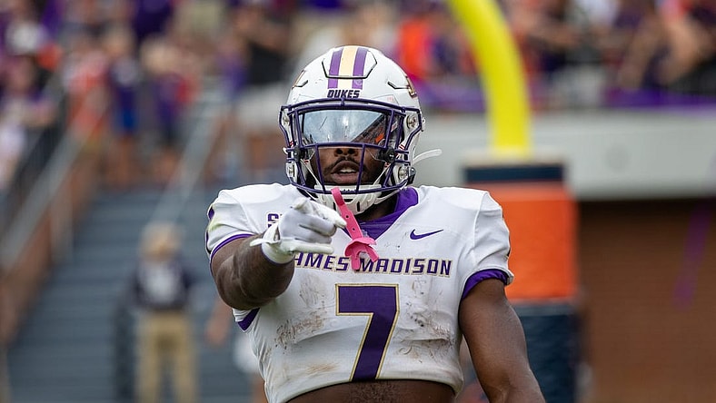 Sept 9, 2023; Charlottesville, Virginia, USA; James Madison Dukes running back Ty Son Lawton (7) points at the camera after scoring a touchdown against the Virginia Cavaliers during the second half at Scott Stadium. Mandatory Credit: Hannah Pajewski-USA TODAY Sports