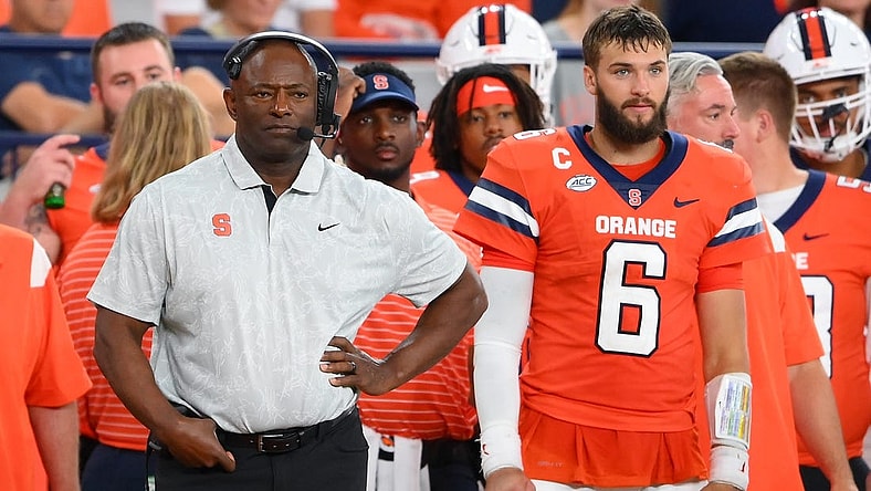 Sep 9, 2023; Syracuse, New York, USA; Syracuse Orange head coach Dino Babers (right) and quarterback Garrett Schrader (6) look on against the Western Michigan Broncos during the second half at the JMA Wireless Dome. Mandatory Credit: Rich Barnes-USA TODAY Sports