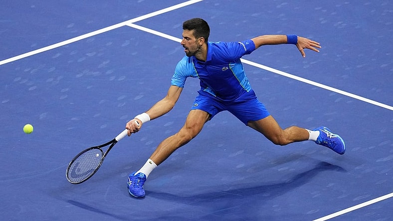 Sep 10, 2023; Flushing, NY, USA; Novak Djokovic of Serbia reaches for a forehand against Daniil Medvedev (not pictured) in the men's singles final in the men's singles final on day fourteen of the 2023 U.S. Open tennis tournament at USTA Billie Jean King National Tennis Center. Mandatory Credit: Danielle Parhizkaran-USA TODAY Sports