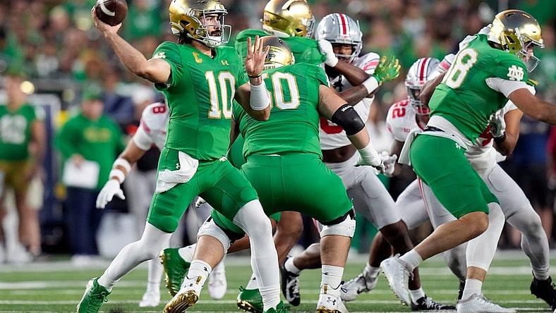 Sep 23, 2023; South Bend, Indiana, USA; Notre Dame Fighting Irish quarterback Sam Hartman (10) throws the ball against Ohio State Buckeyes during the first quarter of their game at Notre Dame Stadium.