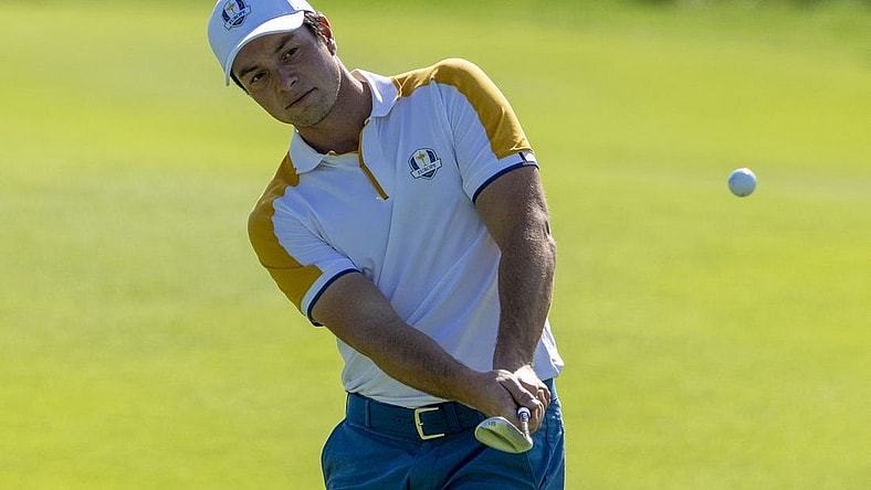 September 26, 2023; Rome, ITALY; Team Europe golfer Viktor Hovland hits his chip shot on the second hole during a practice round of the Ryder Cup golf competition at Marco Simone Golf and Country Club. Mandatory Credit: Kyle Terada-USA TODAY Sports