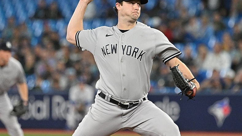 Sep 27, 2023; Toronto, Ontario, CAN; New York Yankee starting pitcher Gerrit Cole (45) delivers a pitch against the Toronto Blue Jays in the first inning at Rogers Centre. Mandatory Credit: Dan Hamilton-USA TODAY Sports