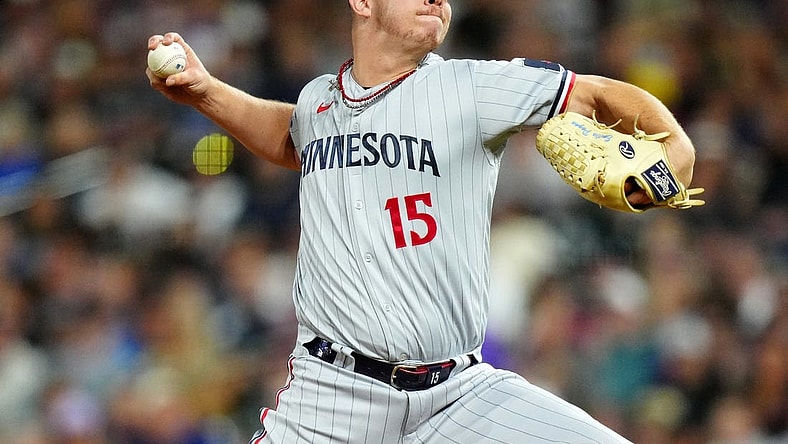 Sep 29, 2023; Denver, Colorado, USA; Minnesota Twins relief pitcher Emilio Pagan (15) delivers a pitch in the ninth inning against the Colorado Rockies at Coors Field. Mandatory Credit: Ron Chenoy-USA TODAY Sports