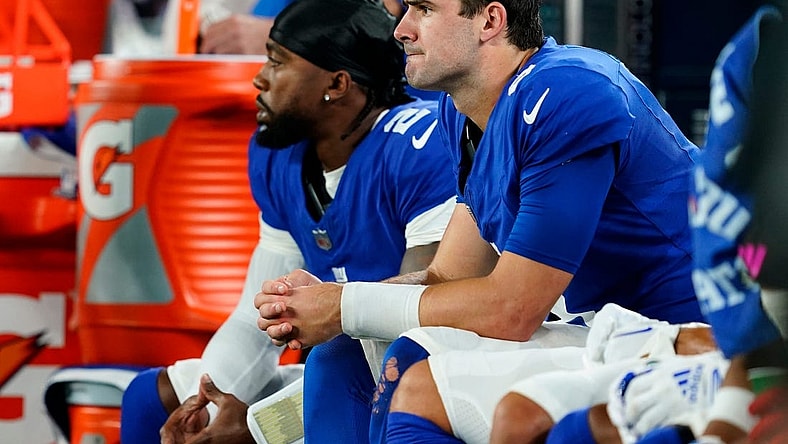 New York Giants quarterback Daniel Jones, right, sits with quarterback Tyrod Taylor (2) in the second half. The Seahawks defeat the Giants, 24-3, at MetLife Stadium on Monday, Oct. 2, 2023, in East Rutherford.