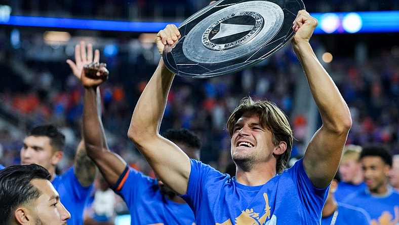 Oct 4, 2023; Cincinnati, Ohio, USA; FC Cincinnati defender Nick Hagglund celebrates with the Supporters Shield at TQL Stadium. Mandatory Credit: Aaron Doster-USA TODAY Sports