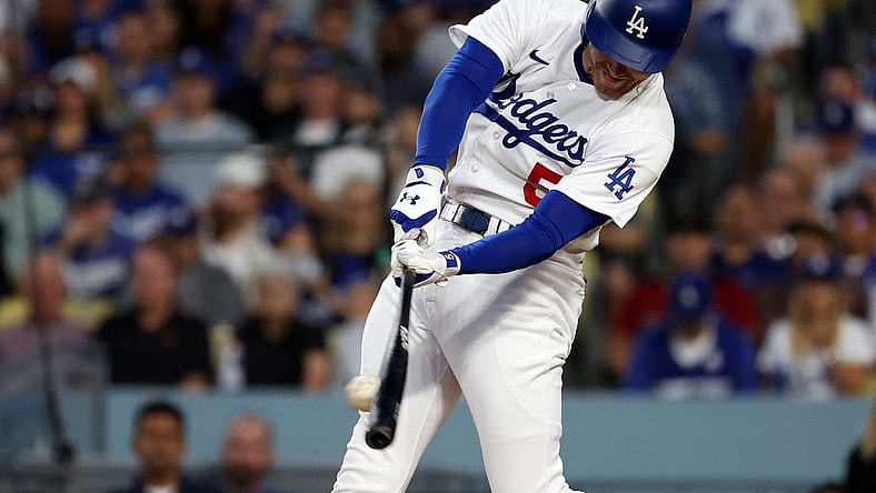 Oct 9, 2023; Los Angeles, California, USA; Los Angeles Dodgers first baseman Freddie Freeman (5) hits a single against the Arizona Diamondbacks in the first inning for game two of the NLDS for the 2023 MLB playoffs at Dodger Stadium. Mandatory Credit: Kiyoshi Mio-USA TODAY Sports