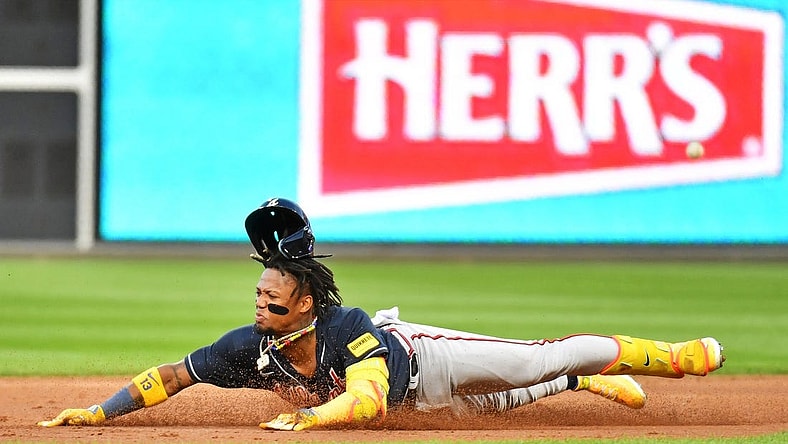 Oct 11, 2023; Philadelphia, Pennsylvania, USA;  Atlanta Braves right fielder Ronald Acuna Jr. (13) slides into second base for a double during the third inning against the Philadelphia Phillies in game three of the NLDS for the 2023 MLB playoffs at Citizens Bank Park. Mandatory Credit: Eric Hartline-USA TODAY Sports