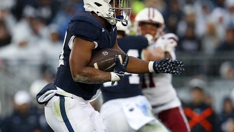Oct 14, 2023; University Park, Pennsylvania, USA; Penn State Nittany Lions running back Kaytron Allen (13) runs with the ball during the second quarter against the Massachusetts Minutemen at Beaver Stadium. Penn State defeated Massachusetts 63-0. Mandatory Credit: Matthew O'Haren-USA TODAY Sports